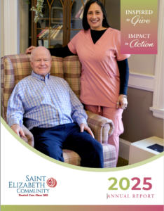 Caregiver in pink scrubs stands beside an elderly man seated in a plaid armchair; cover reads 'Inspired to Give, Impact in Action' for Saint Elizabeth Community 2025 Annual Report.
